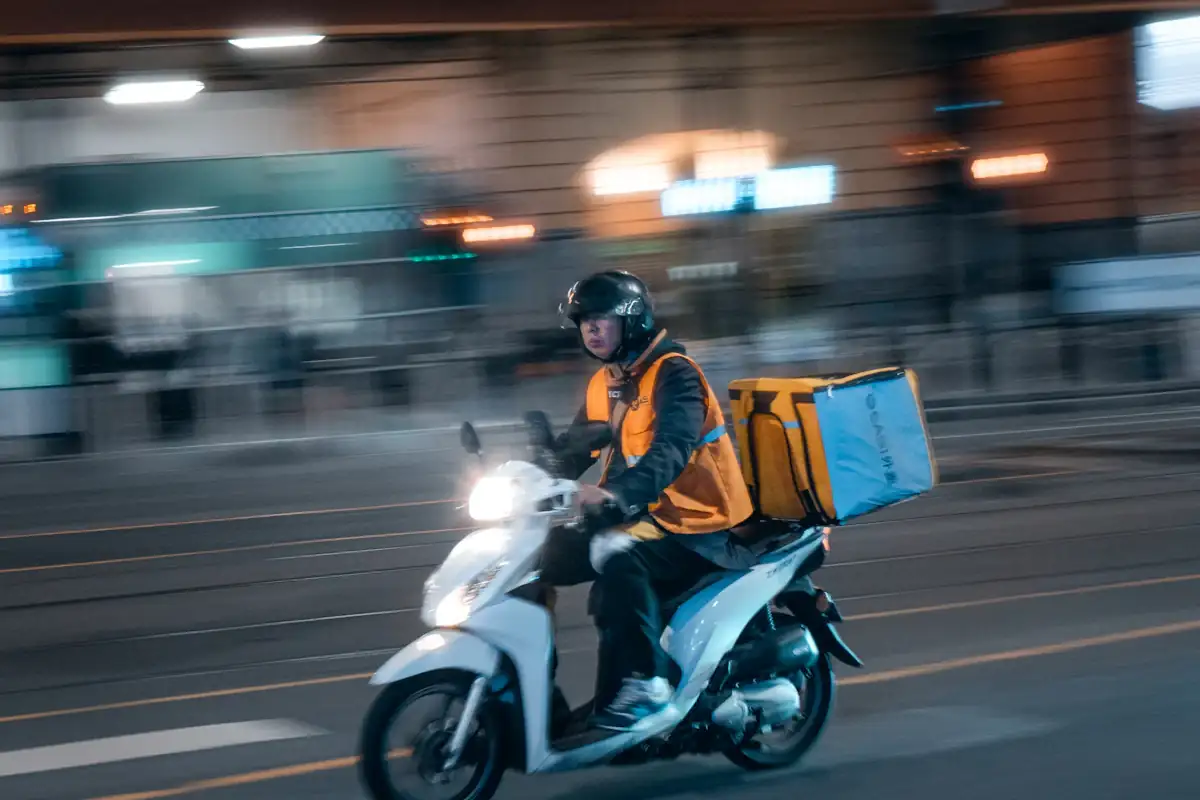 Delivery rider arriving at an estate gate