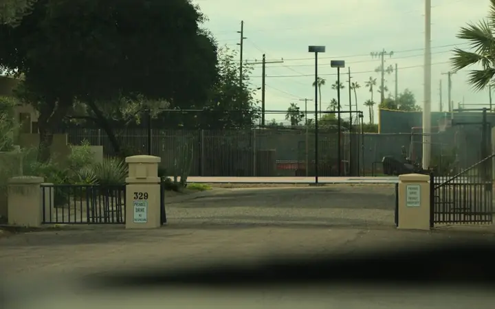 Driveway leading to an estate gate